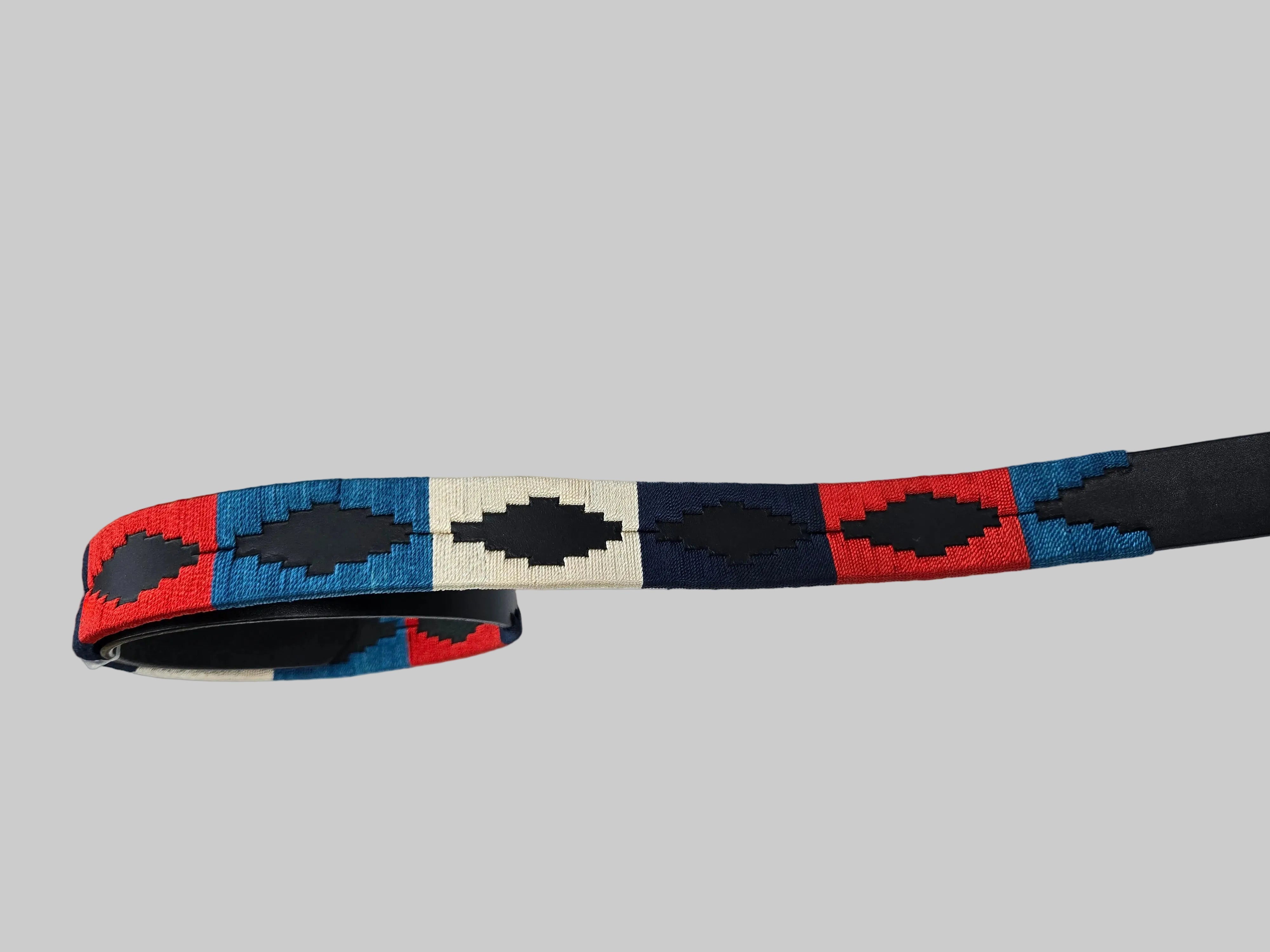 Colorful belt with geometric pattern on a white surface