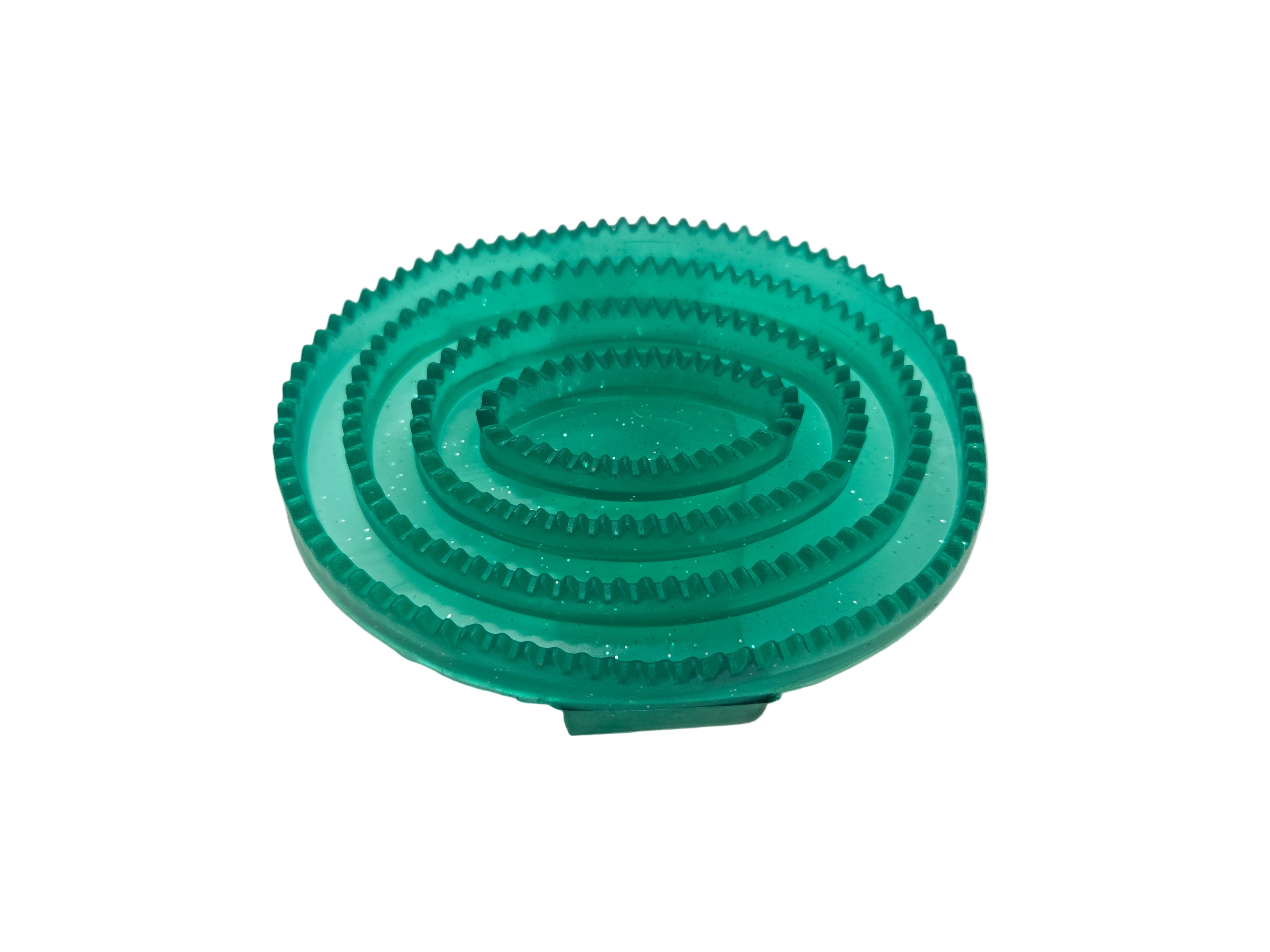 Green plastic gear on a white background