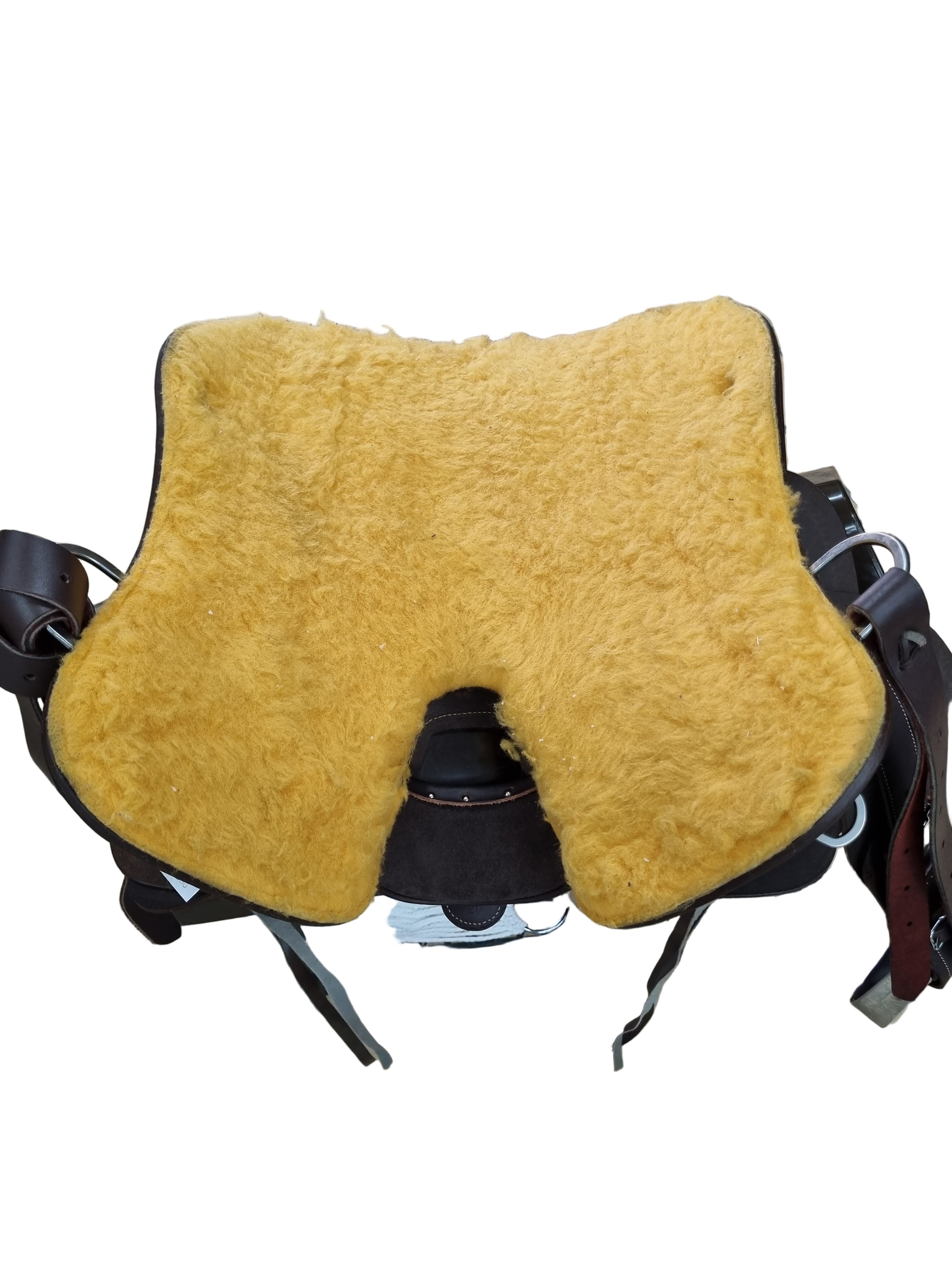 Yellow cushion on a saddle with a tiled floor background