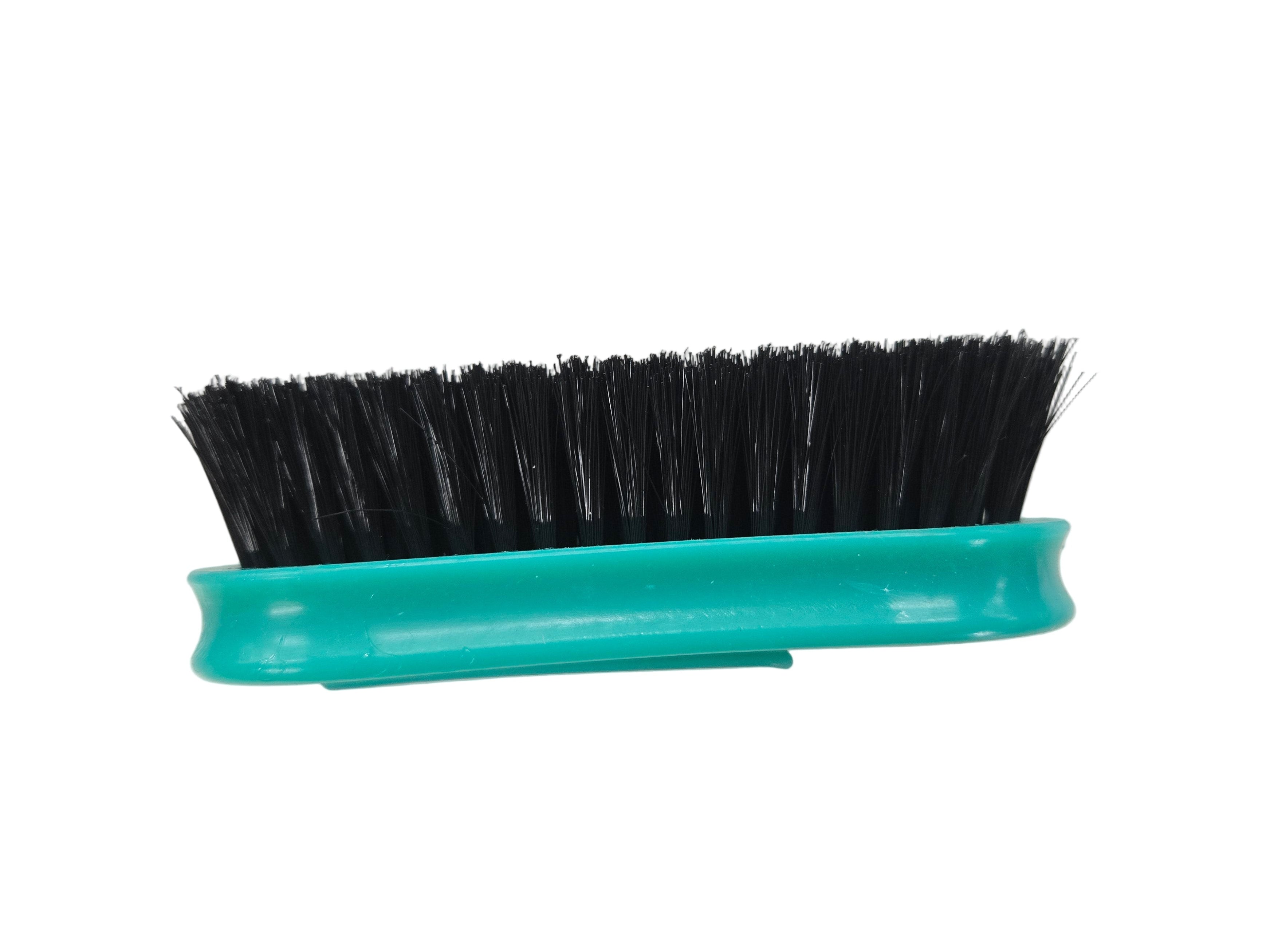Teal brush with black bristles on a white background