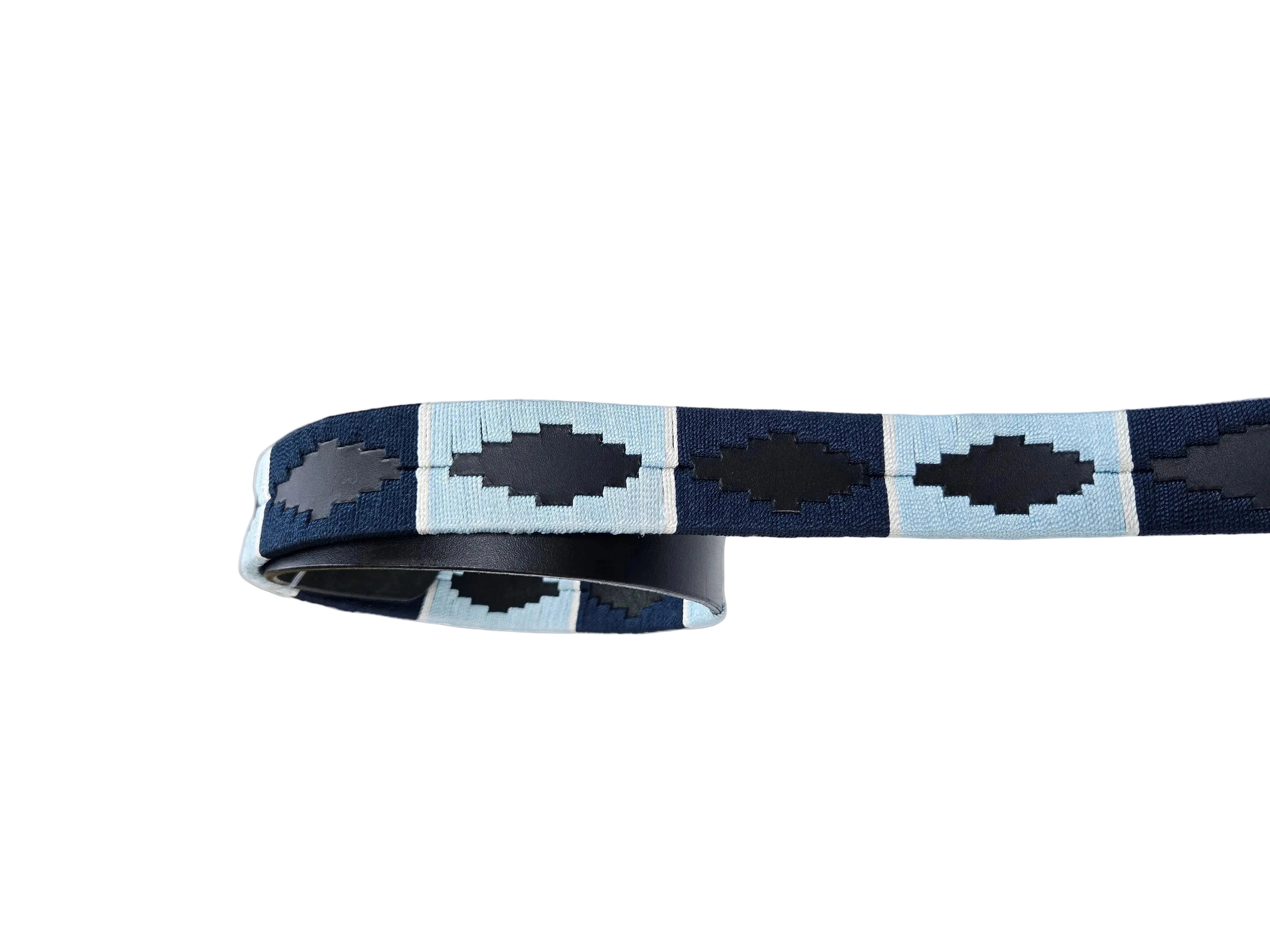 Navy and light blue patterned belt on a white surface with a blurred background