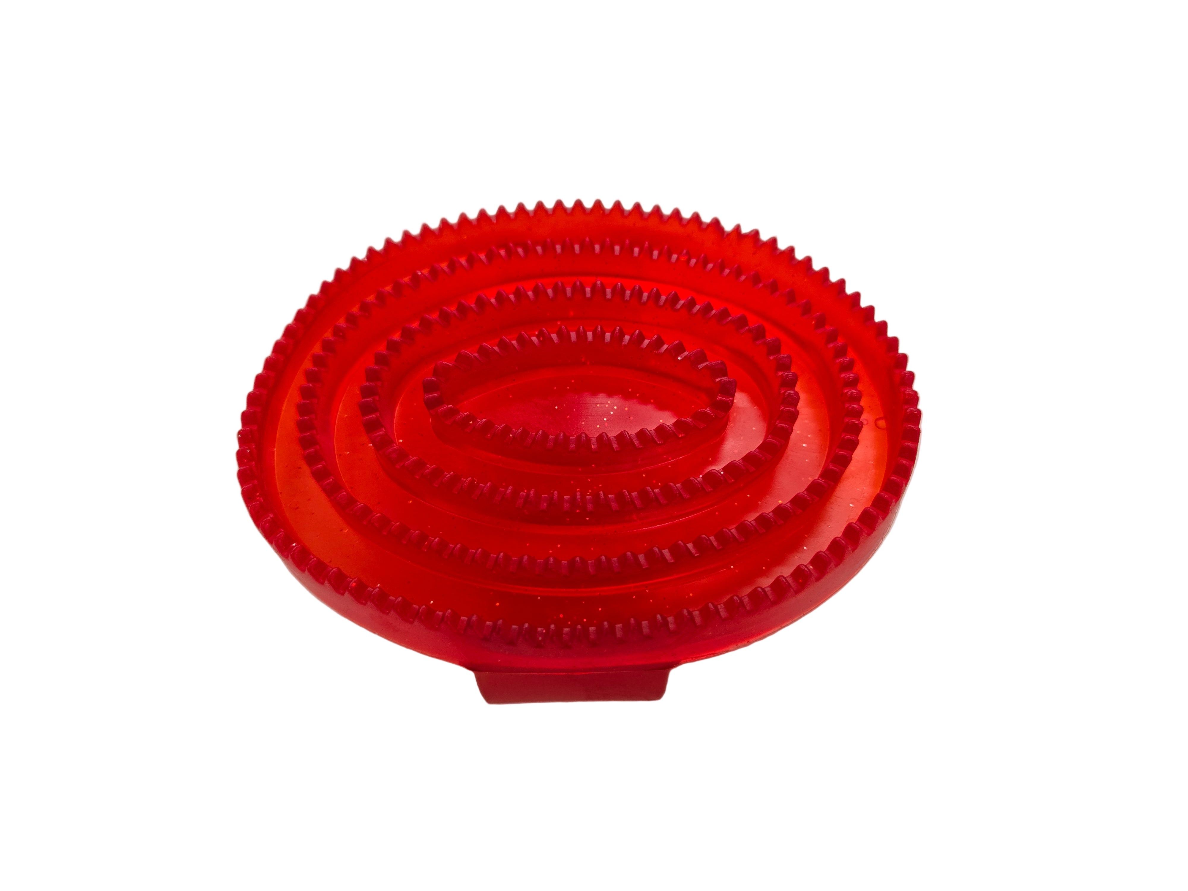Red plastic tool with textured surface on a white background