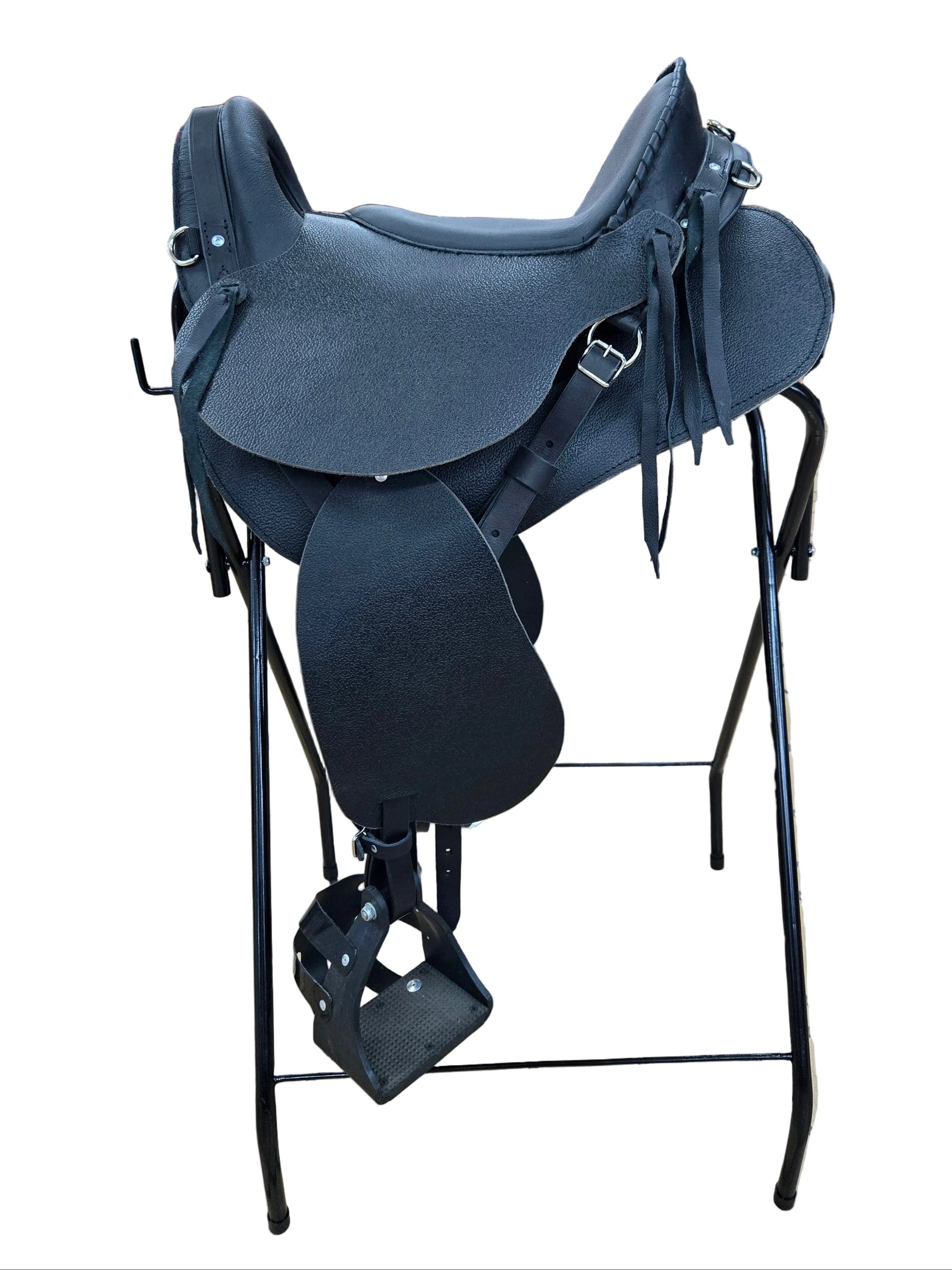 Horse saddle on display in a store with tiled floor