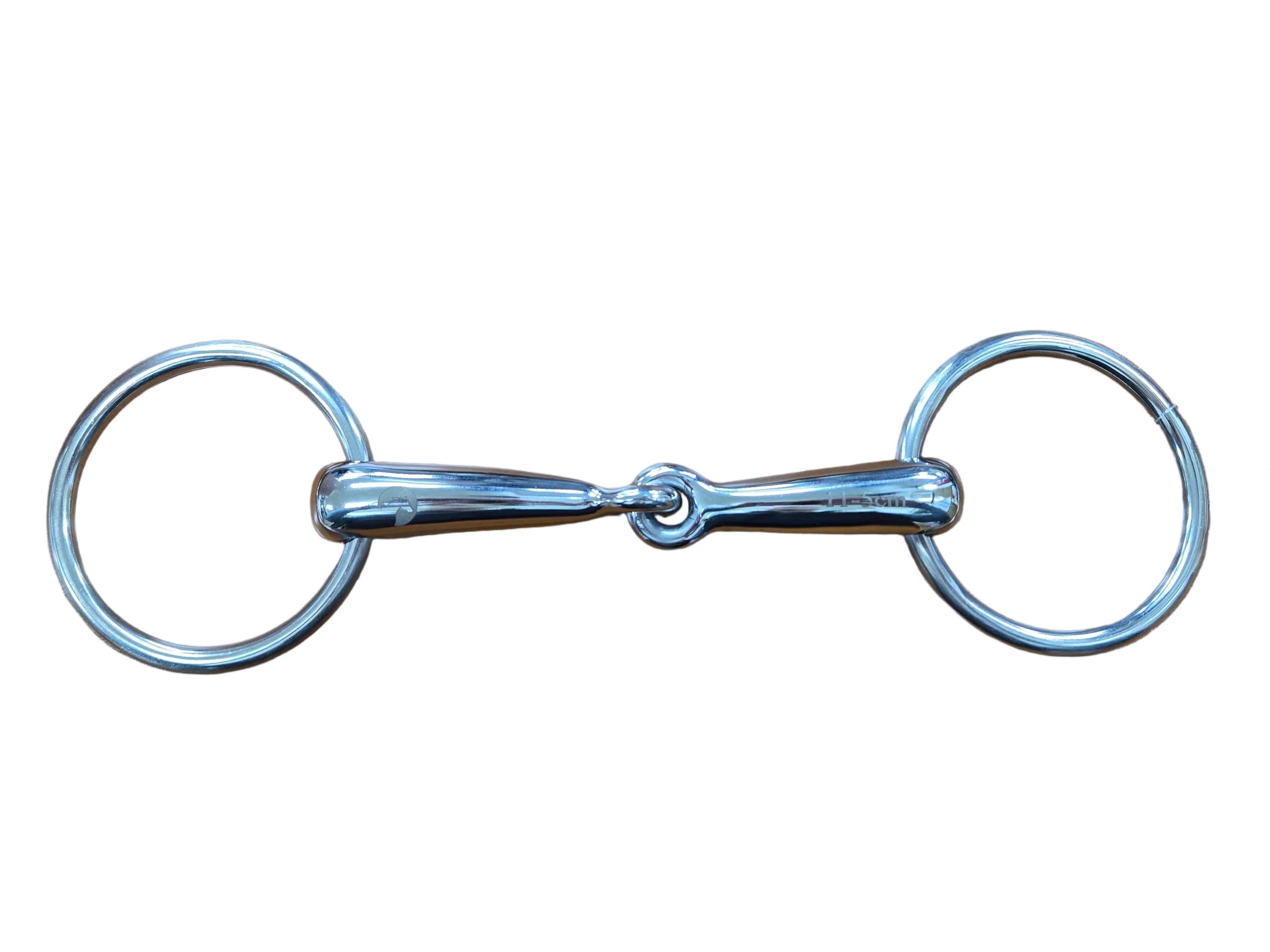Metal snaffle bit on a wooden surface with a white mug and black item in the background.